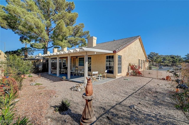 rear view of house featuring a patio area