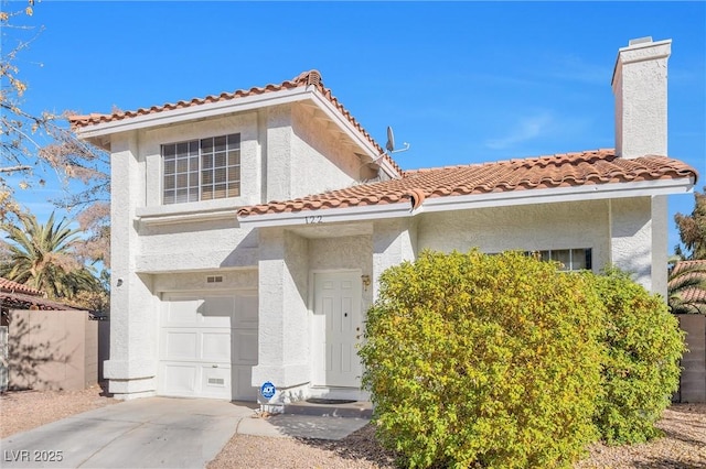 mediterranean / spanish-style house featuring a garage