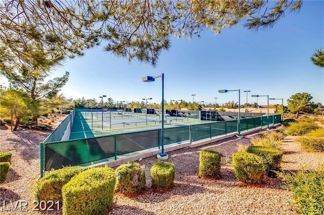 view of sport court with fence