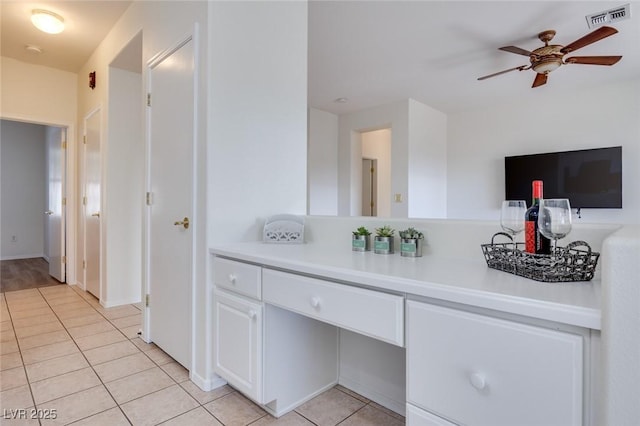 bathroom with tile patterned flooring, visible vents, and a ceiling fan