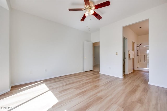 unfurnished bedroom with light wood-style floors, ceiling fan, ensuite bath, and baseboards