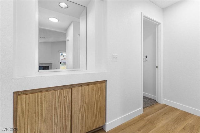 hall with light hardwood / wood-style flooring