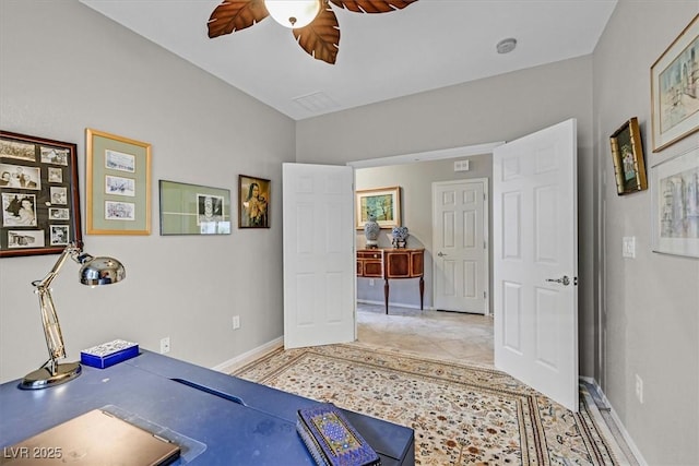 workout area with ceiling fan and light tile patterned floors