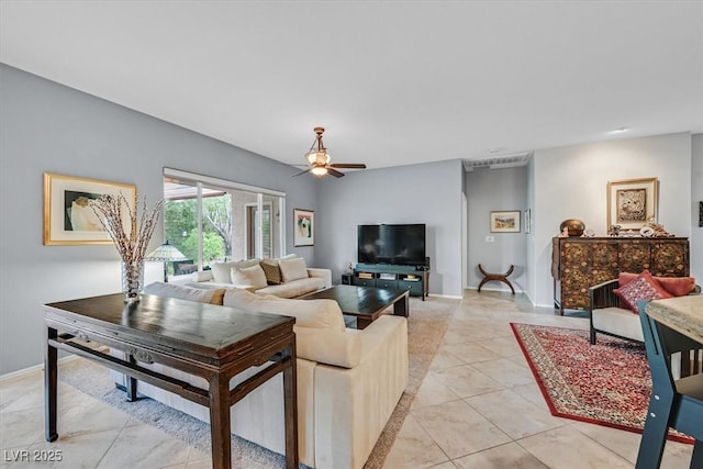 tiled living room featuring ceiling fan