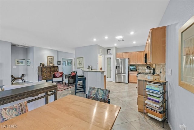 dining area featuring light tile patterned floors