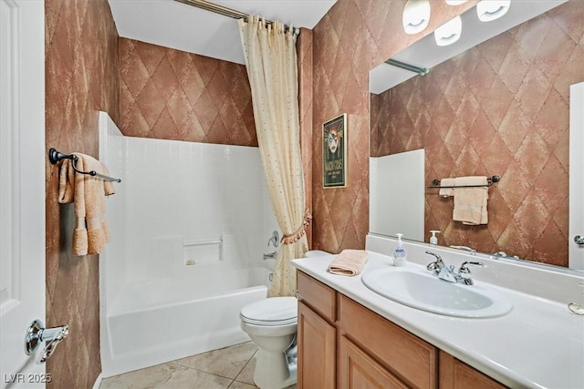 full bathroom with shower / bath combo, tile patterned flooring, tile walls, vanity, and toilet