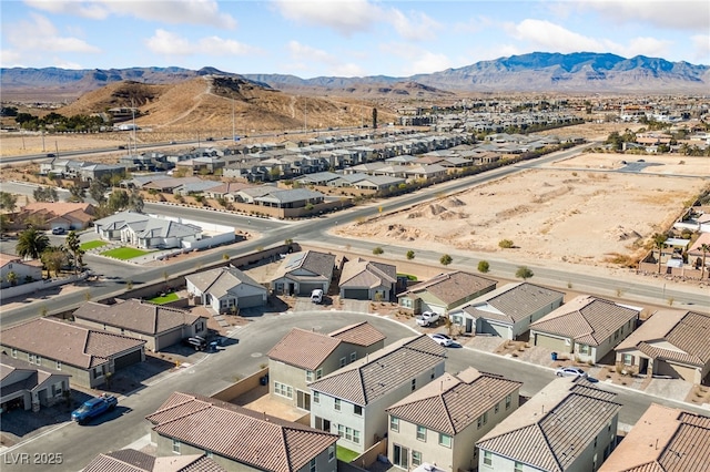 birds eye view of property with a mountain view