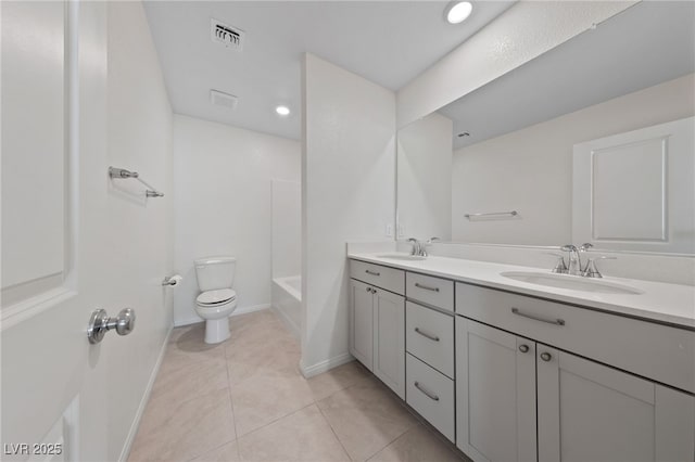 full bathroom with tile patterned flooring, vanity, bathing tub / shower combination, and toilet