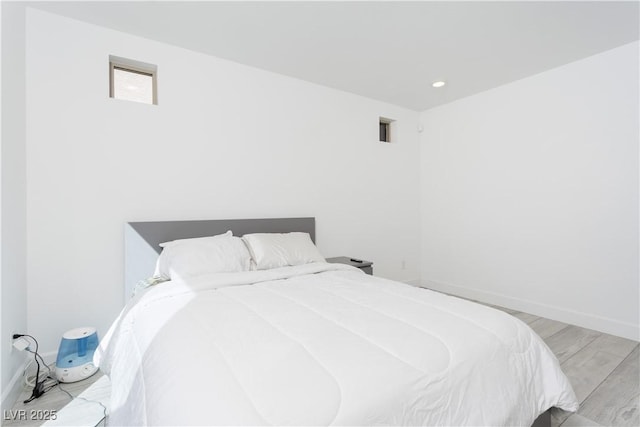 bedroom with light wood-type flooring