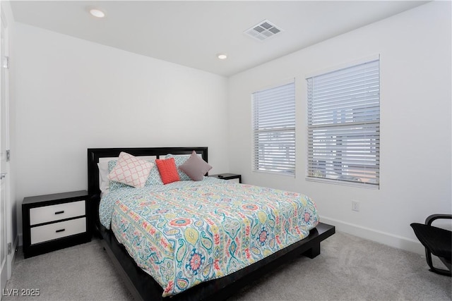 bedroom featuring light colored carpet