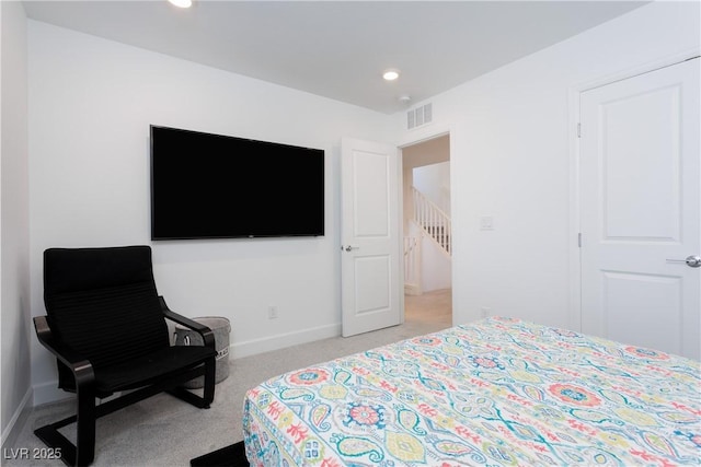 bedroom with light carpet