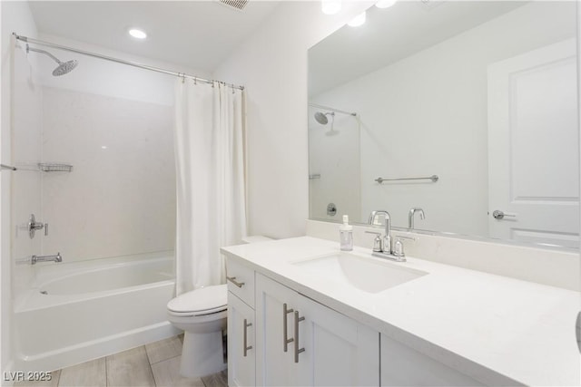 full bathroom with vanity, toilet, and shower / bath combo