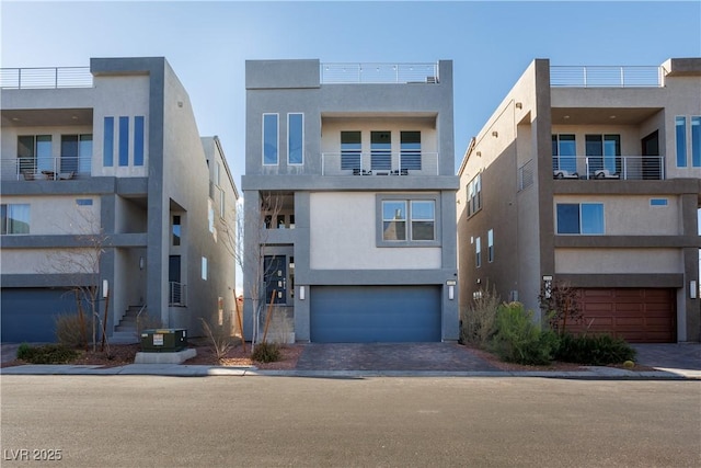 contemporary house featuring a garage and central air condition unit