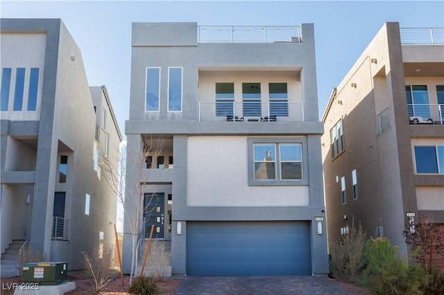 modern home featuring a garage and cooling unit