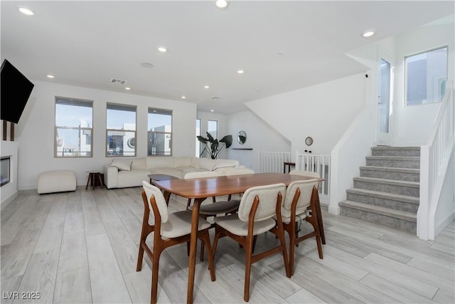 dining space featuring a healthy amount of sunlight and light wood-type flooring