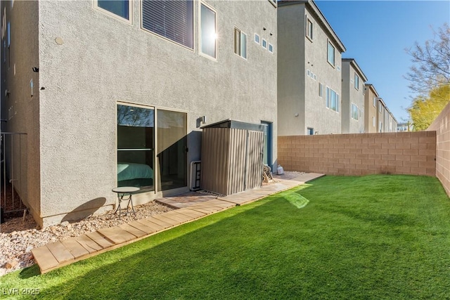 rear view of house with a yard