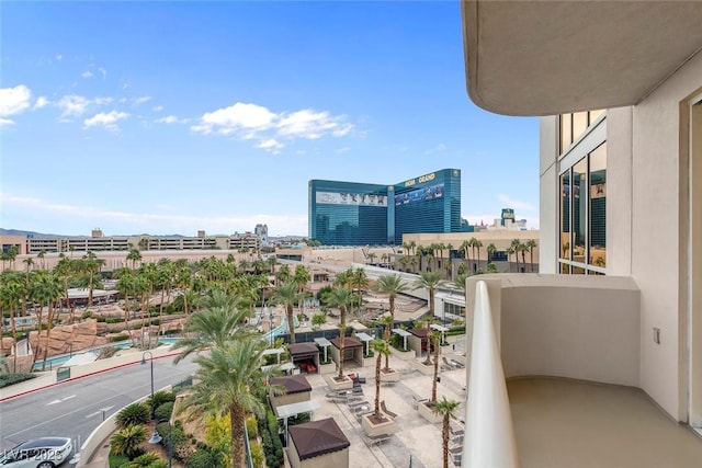 balcony with a view of city and central air condition unit