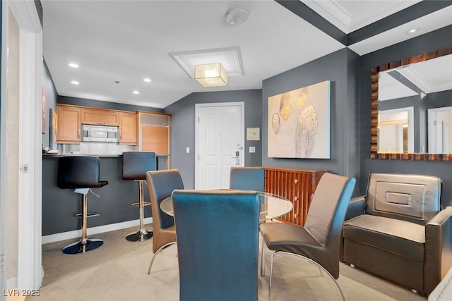 dining space featuring ornamental molding, recessed lighting, and baseboards