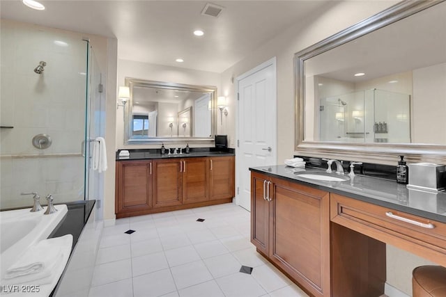 full bath with two vanities, visible vents, a sink, a shower stall, and a bath