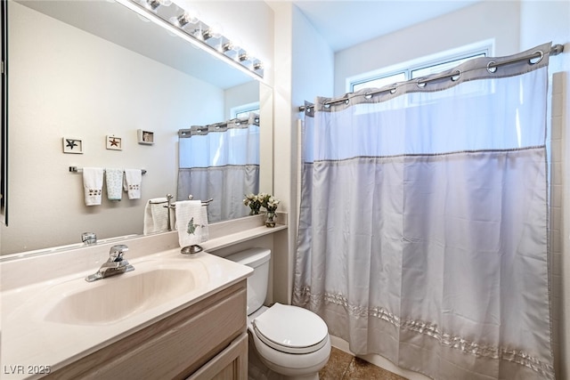 bathroom featuring vanity, a shower with curtain, and toilet