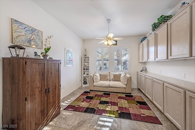 living area featuring ceiling fan