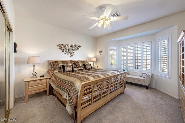 carpeted bedroom featuring ceiling fan