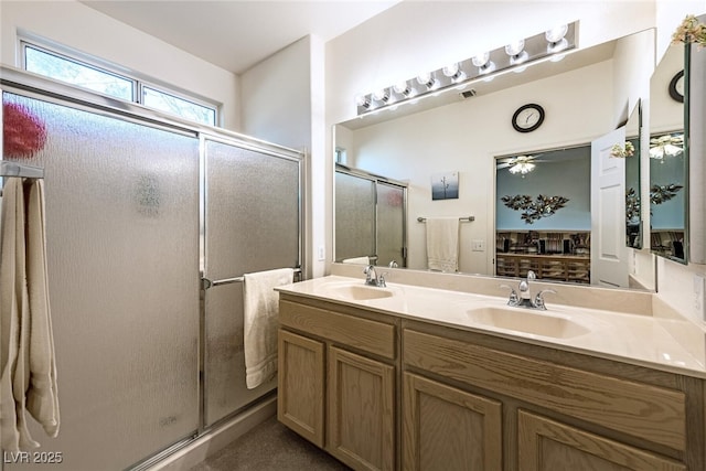 bathroom with walk in shower and vanity