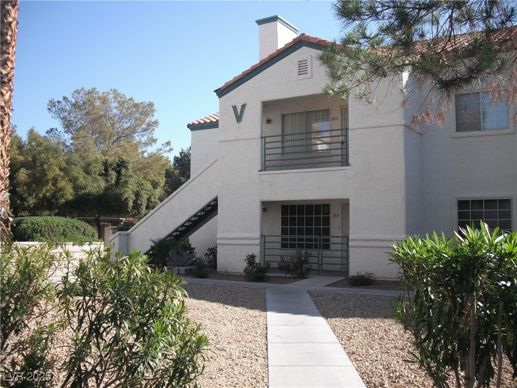 mediterranean / spanish home featuring a balcony