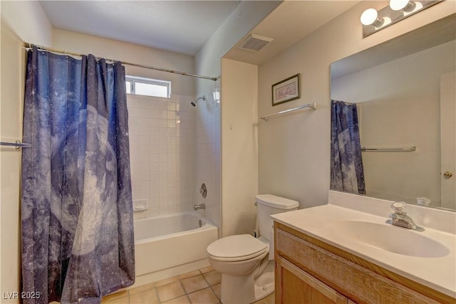 full bathroom with tile patterned flooring, vanity, shower / tub combo with curtain, and toilet