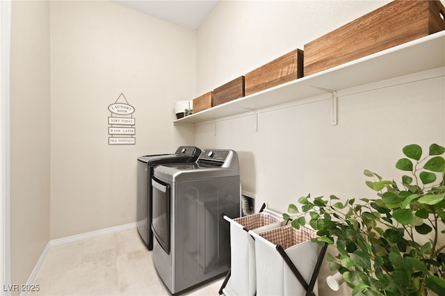 laundry room featuring separate washer and dryer