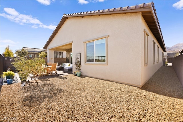 rear view of house featuring a patio area