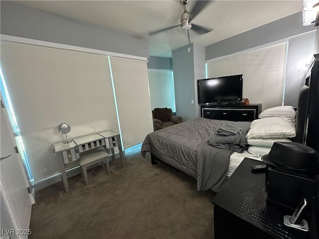 carpeted bedroom featuring ceiling fan and a closet