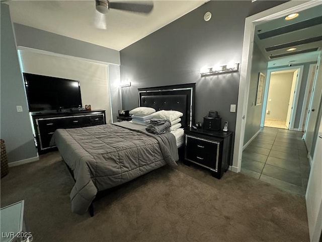 carpeted bedroom with vaulted ceiling and ceiling fan