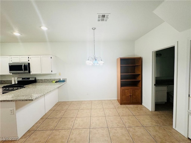 kitchen featuring pendant lighting, appliances with stainless steel finishes, light stone counters, white cabinets, and kitchen peninsula