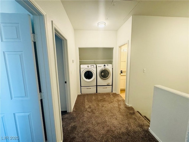 washroom featuring separate washer and dryer and dark colored carpet