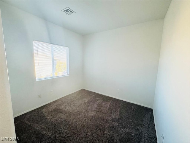 unfurnished room featuring carpet