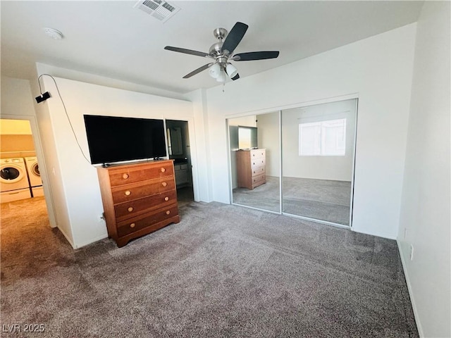 unfurnished bedroom with ceiling fan, a closet, carpet flooring, and washer and dryer