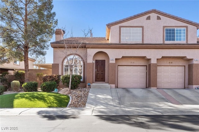 mediterranean / spanish-style home with a garage