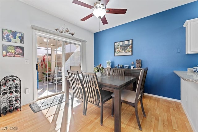 dining space featuring ceiling fan and light hardwood / wood-style flooring