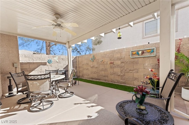 view of patio / terrace featuring ceiling fan