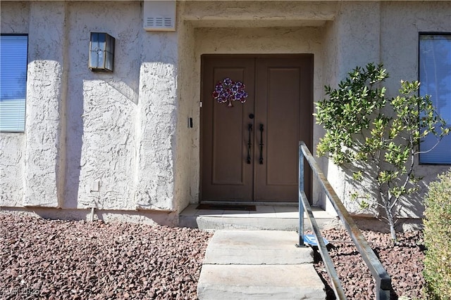 3126 Asoleado Cir, Las Vegas, NV 89121 - doorway to property featuring stucco siding