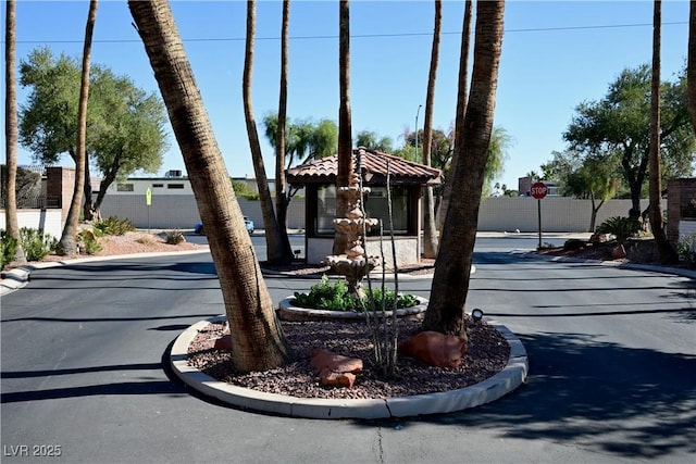 3126 Asoleado Cir, Las Vegas, NV 89121 - view of asphalt road featuring curbs and traffic signs