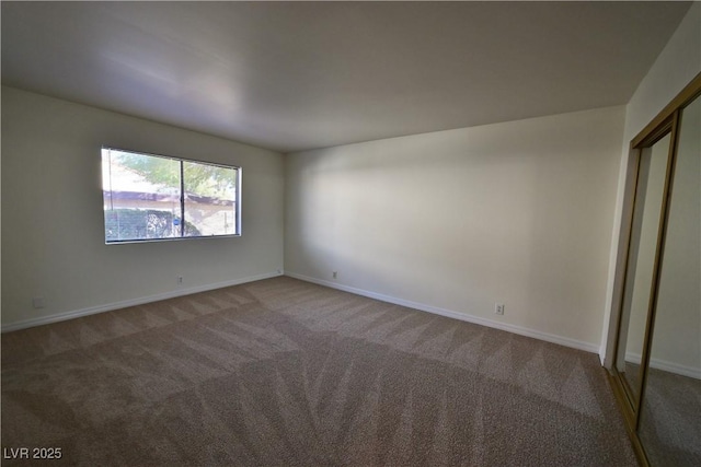 unfurnished bedroom featuring a closet and carpet