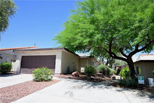 3126 Asoleado Cir, Las Vegas, NV 89121 - view of front of home featuring an attached garage, stucco siding, and concrete driveway