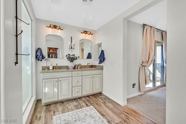 bathroom featuring vanity and hardwood / wood-style floors