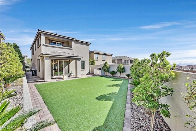 rear view of property featuring a patio