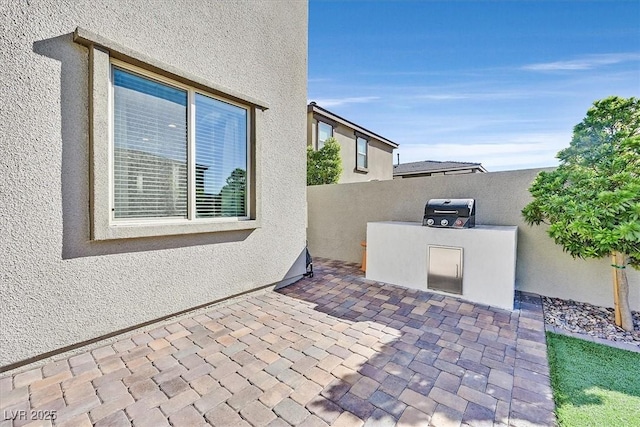 view of patio / terrace featuring a grill