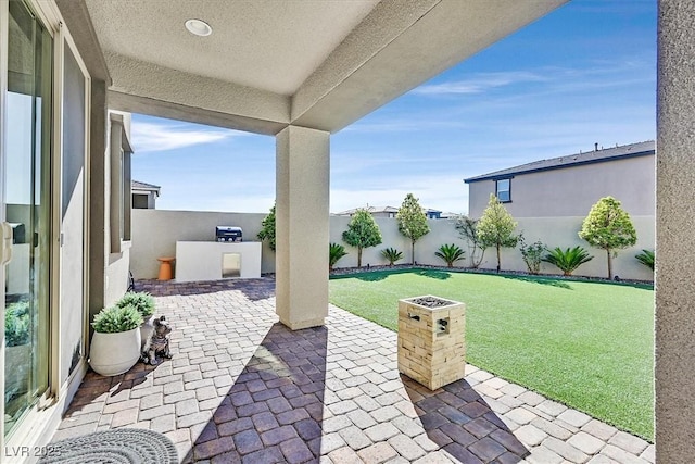 view of patio / terrace featuring exterior kitchen