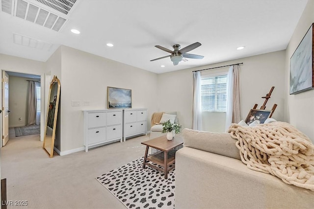 living room with light carpet and ceiling fan