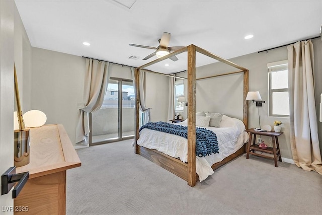 carpeted bedroom featuring ceiling fan, access to exterior, and multiple windows